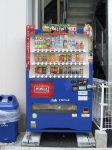 A typical Japanese vending machine with three rows behind a plactis window