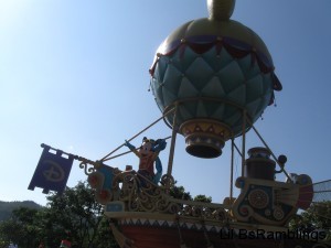Mickey and his friends on a sailing boat with an air ballon attached